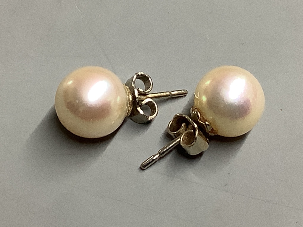 A pair of white metal and cultured pearl stud earrings